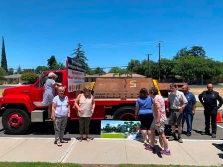 Community members viewing the steel beam on fire truck